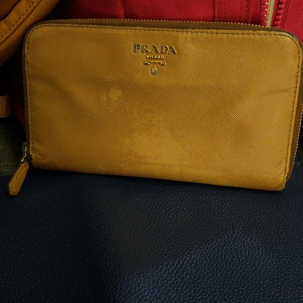 Pre-Loved vintage Prada cognac zip around saffiano wallet gold h.w.